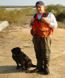 USDA APHIS dog handler and dog, Nutria eradication project, Maryland, USA. Highly- trained dog-handler teams have been key “low-tech” tools in many eradication operations to locate the last few remaining individuals of the targeted pest.